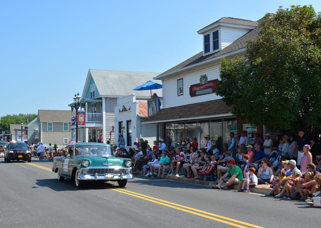 Antique car enthusiasts participate in the Rock Hall 4th of July parade