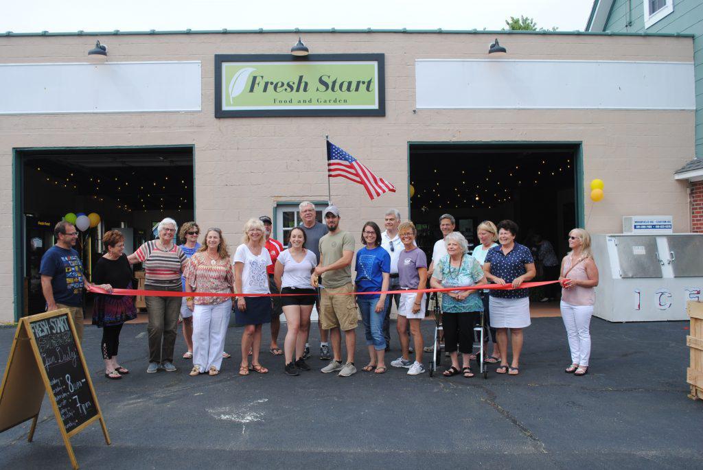 Cutting the ribbon for Fresh Start Food and Garden's grand opening<