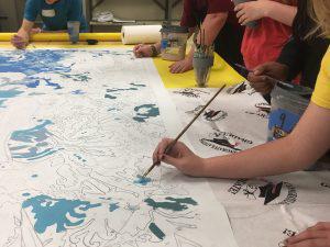 Students doing prep work on Bayside Market mural